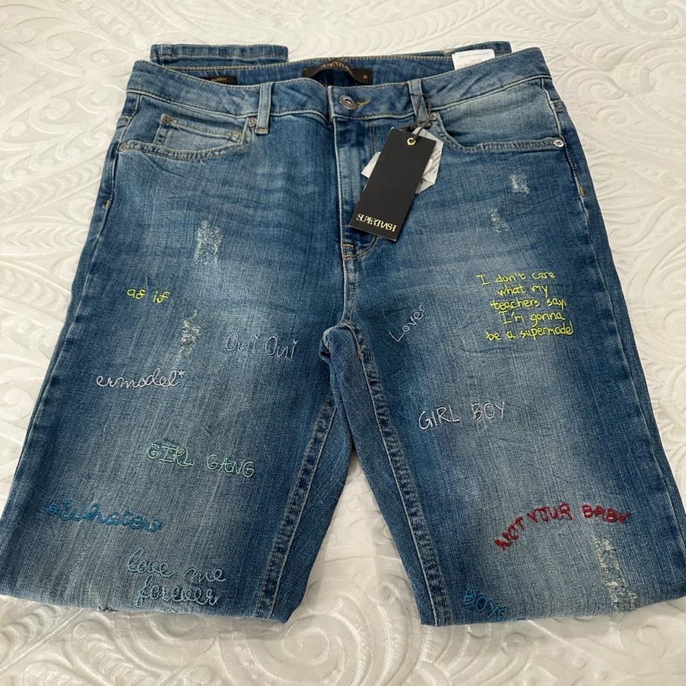 SuperRast women Jeans Blue with multiple writing on it